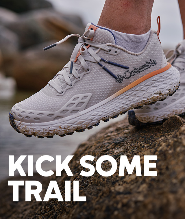 Kick some trail. Close-up of a person wearing Columbia hiking shoes. 