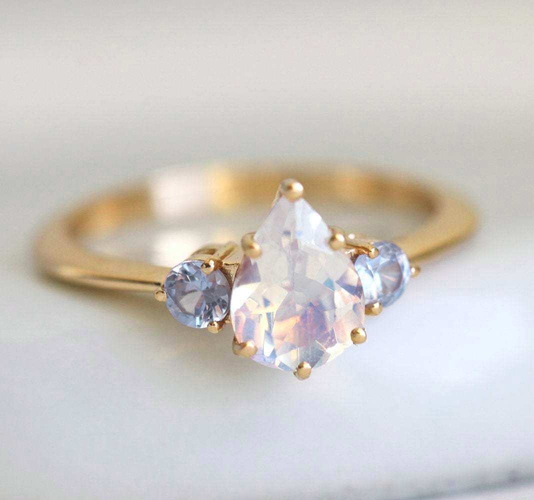 Image of Moonstone Ring With Light Blue Sapphires