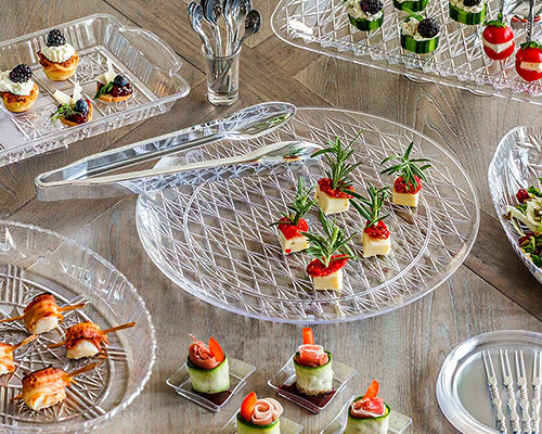 Blog idea: simple serveware ideas showing clear catering trays and supplies with hors d'oeuvres