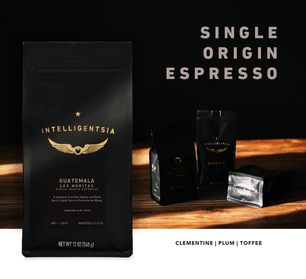 Guatemala Las Moritas, Single origin espresso bag atop a moody photo of multiple espresso bags capturing a small sunbeam in darkness