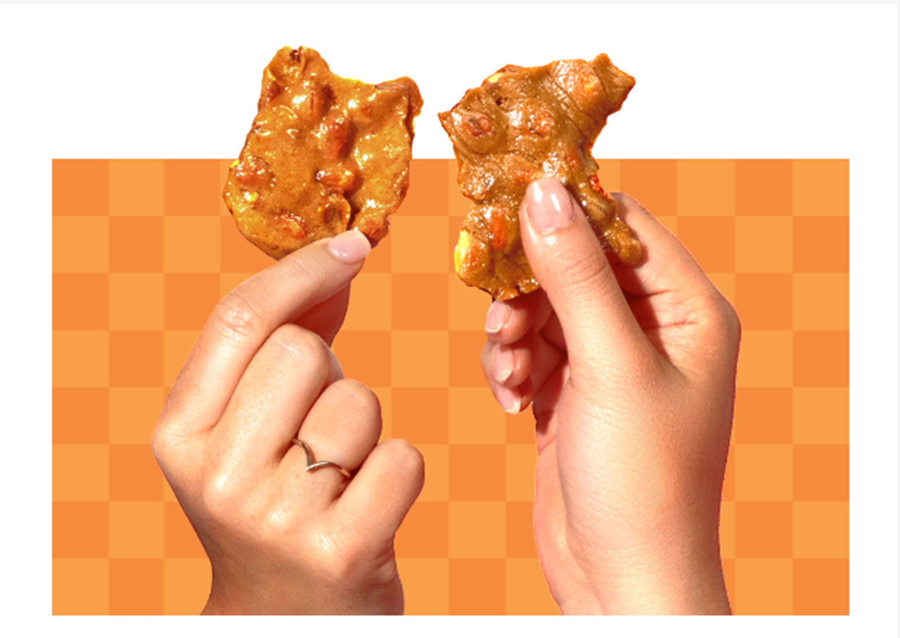 Hands holding Peanut Brittle