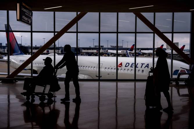 View of a Delta plane from inside an airport