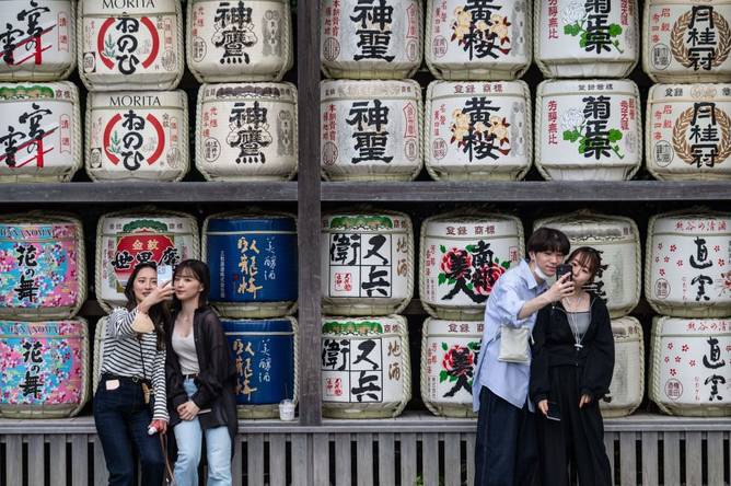 People taking selfies in Japan