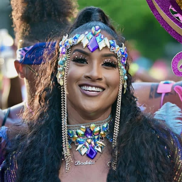 A woman dressed in traditional Caribbean carnival wear